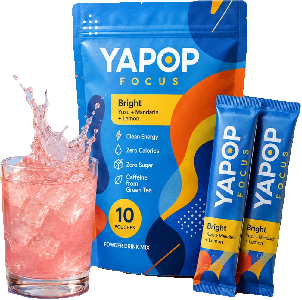 YaPOP Focus Bright pouch with two stick packs and a glass of iced citrus drink
